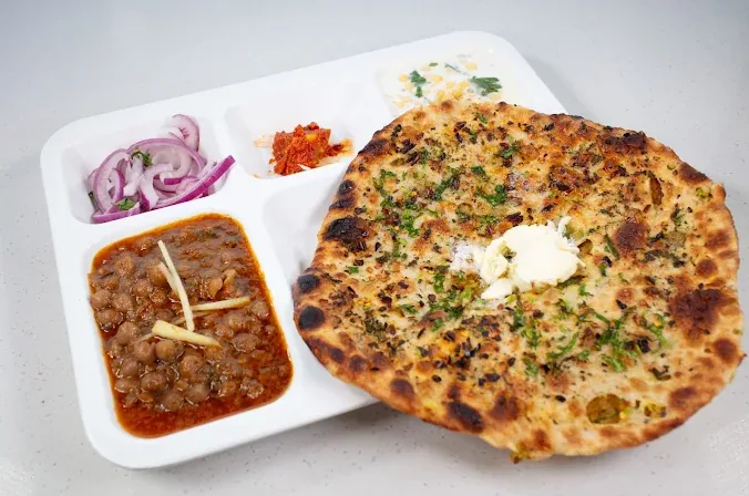 Naan, curry, and pickled sides