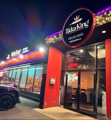 Tikka King storefront on Rexdale Blvd at night